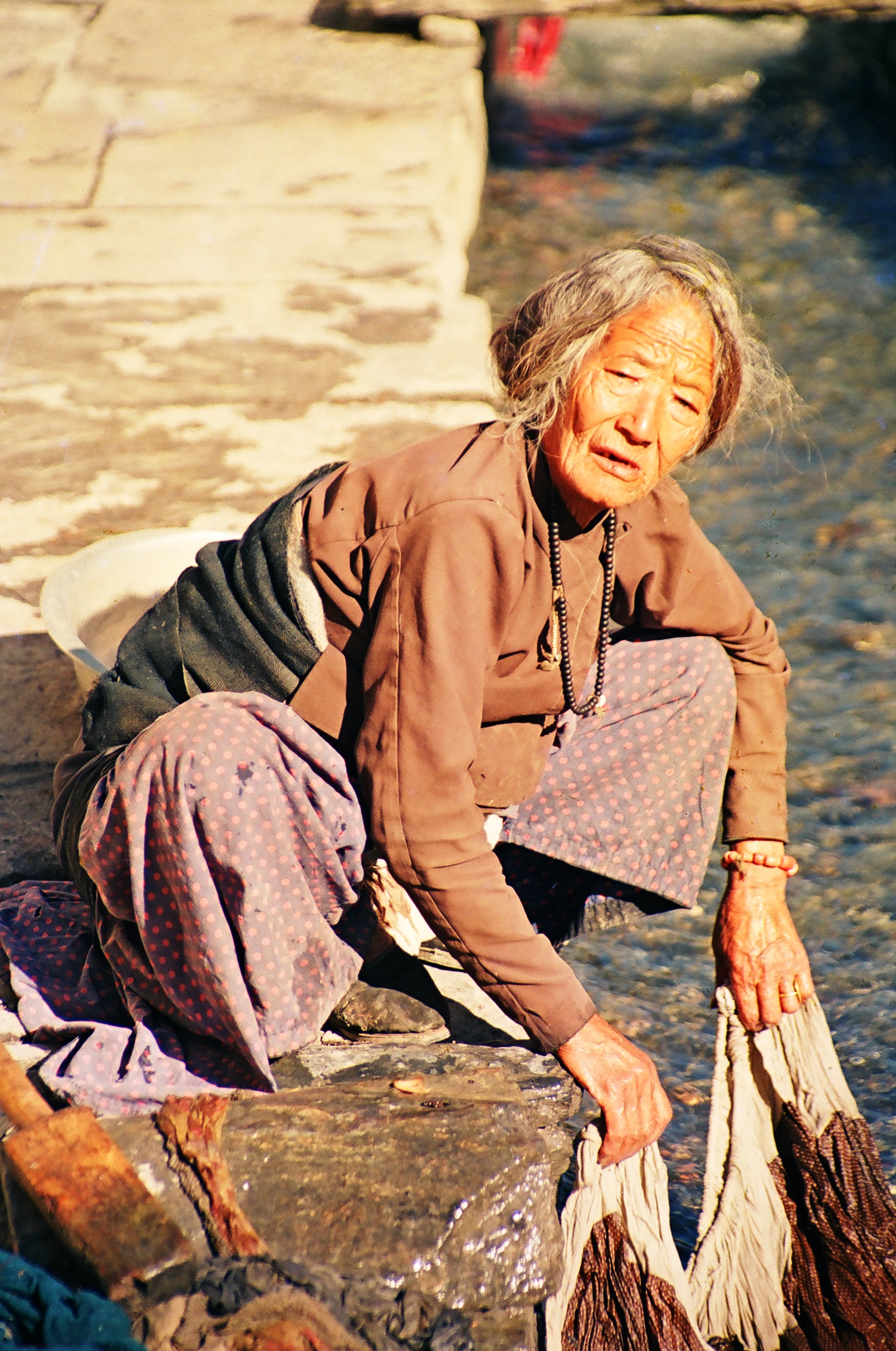 Washing Clothes in a Mountain Stream, Tatopani, Nepal (1989)